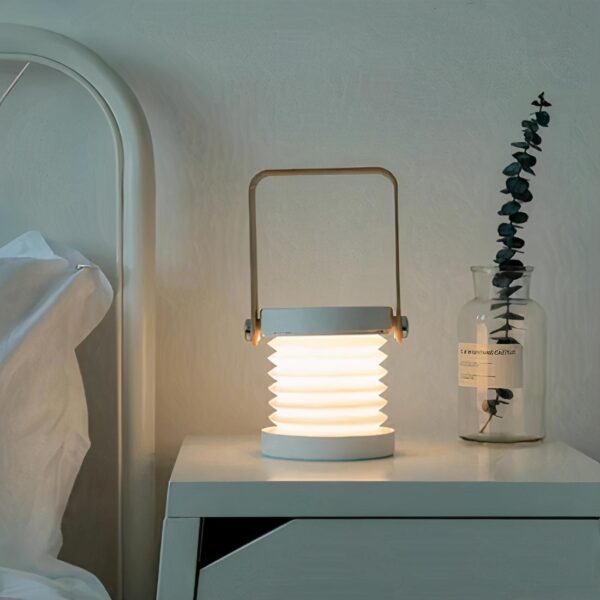 lampe de chevet pliable et tactile sur une table