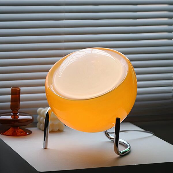 lampe de chevet ronde posé sur une table de chevet