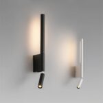 Lampe de lecture au lit design noire ou blanche, dans ses deux variantes de couleur, fixées sur un mur blanc.