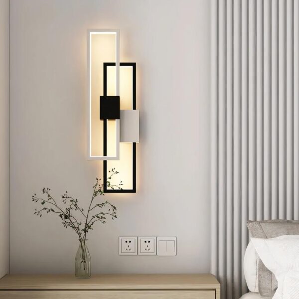 lampe de chevet chambre murale design posé près d'un lit sur le mur