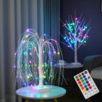 lampe de chevet original en forme de saule pleure de couleur multicolore posée sur une table