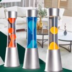 3 lampes à lave orange, bleu et jaune avec un socle gris